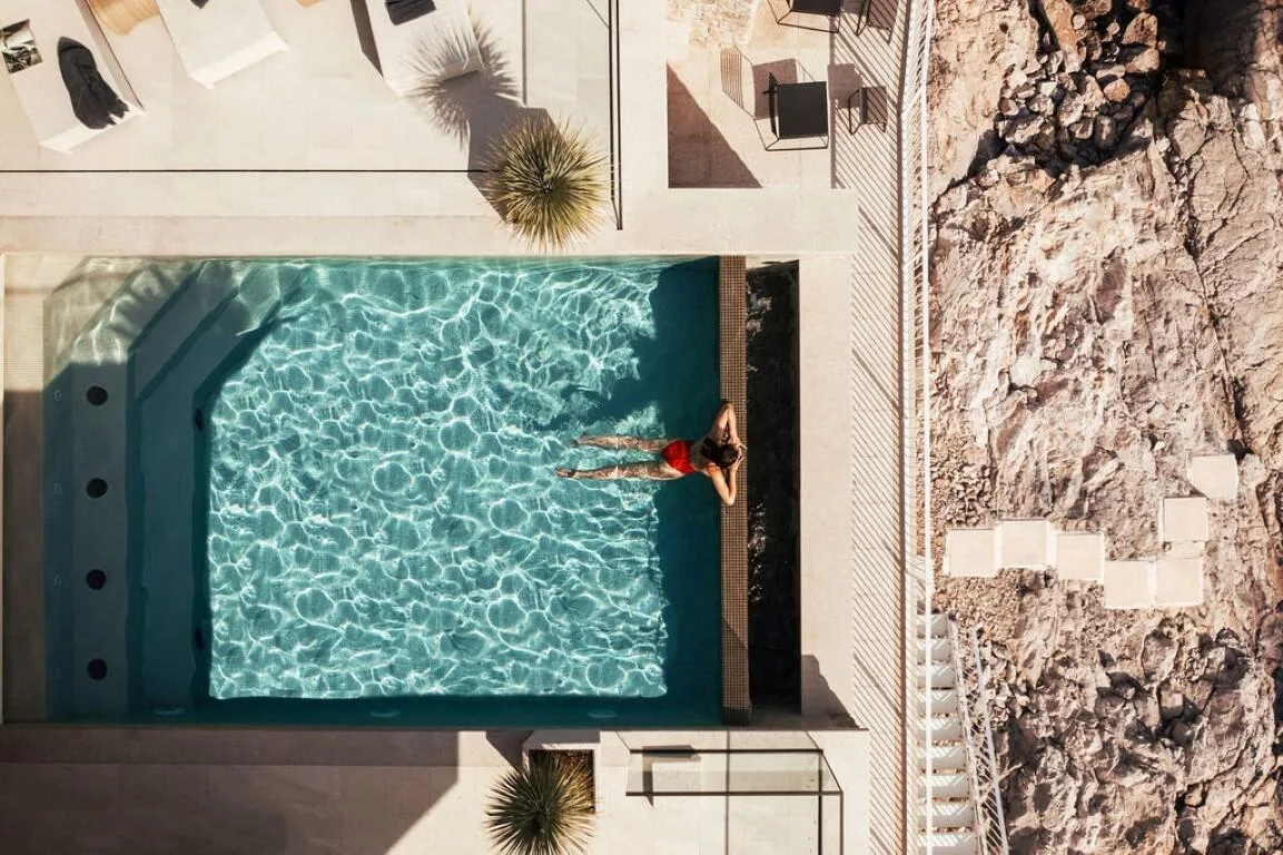 Overhead view of the pool with a swimmer at Villa Anthon