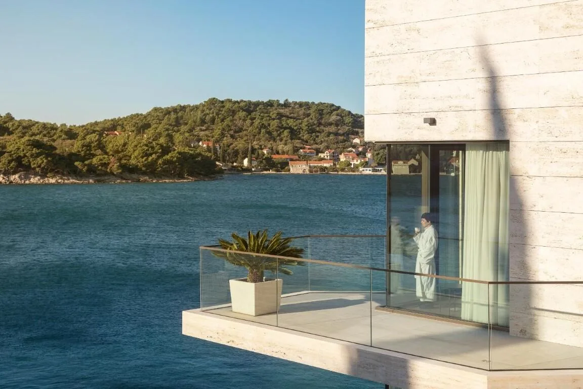 Glass balcony above the sea with island views at Villa Anthon