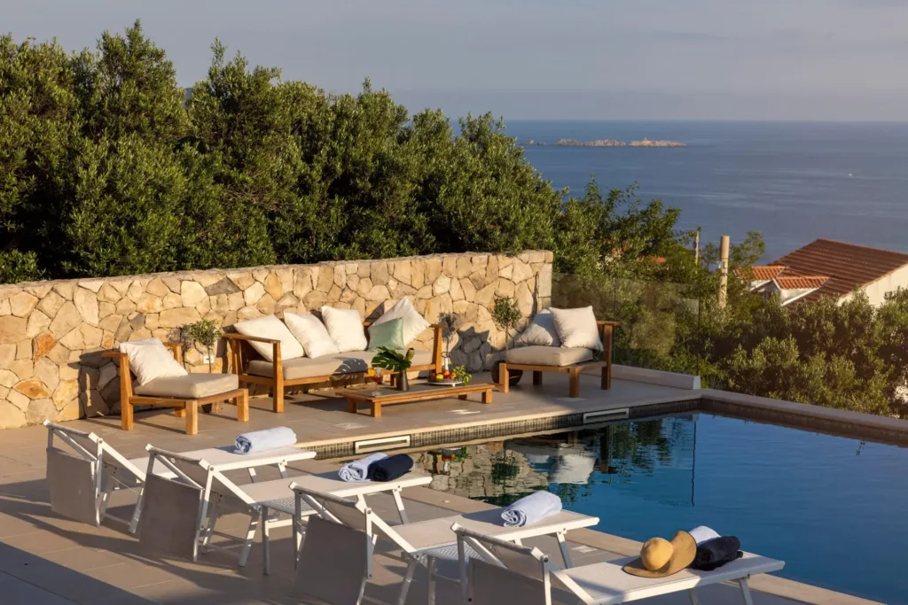 Heated pool and stone terrace with sea view at Villa MaR in Orašac