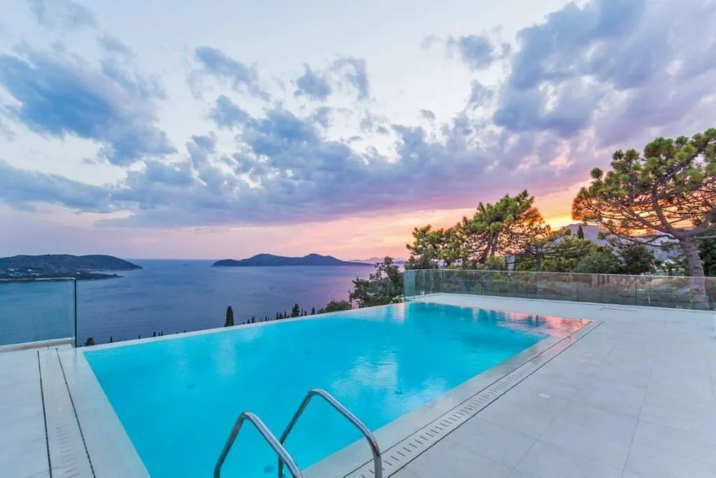 Pool and terrace overlooking the sea at sunset at Villa Vintage