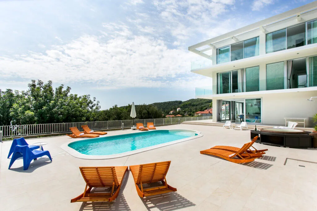 Modern Villa Art with heated pool and sun loungers above Zaton Bay