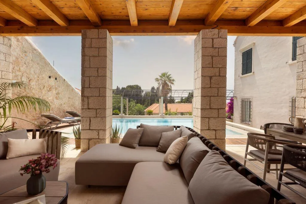 Loggia lounge with sofas and pool view at Villa La Rose, Dubrovnik