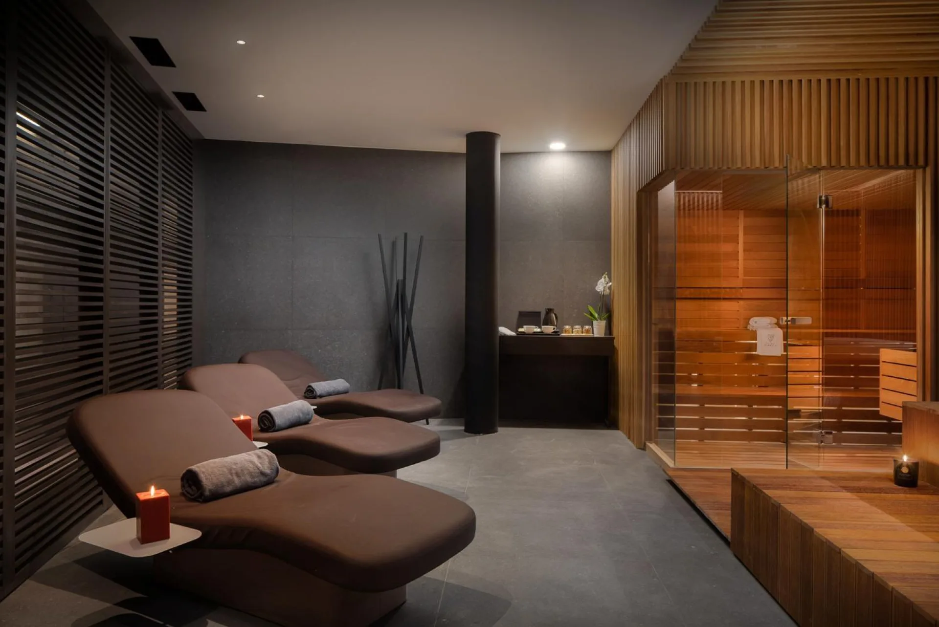 Private spa with heated loungers and sauna at Villa Palazzo