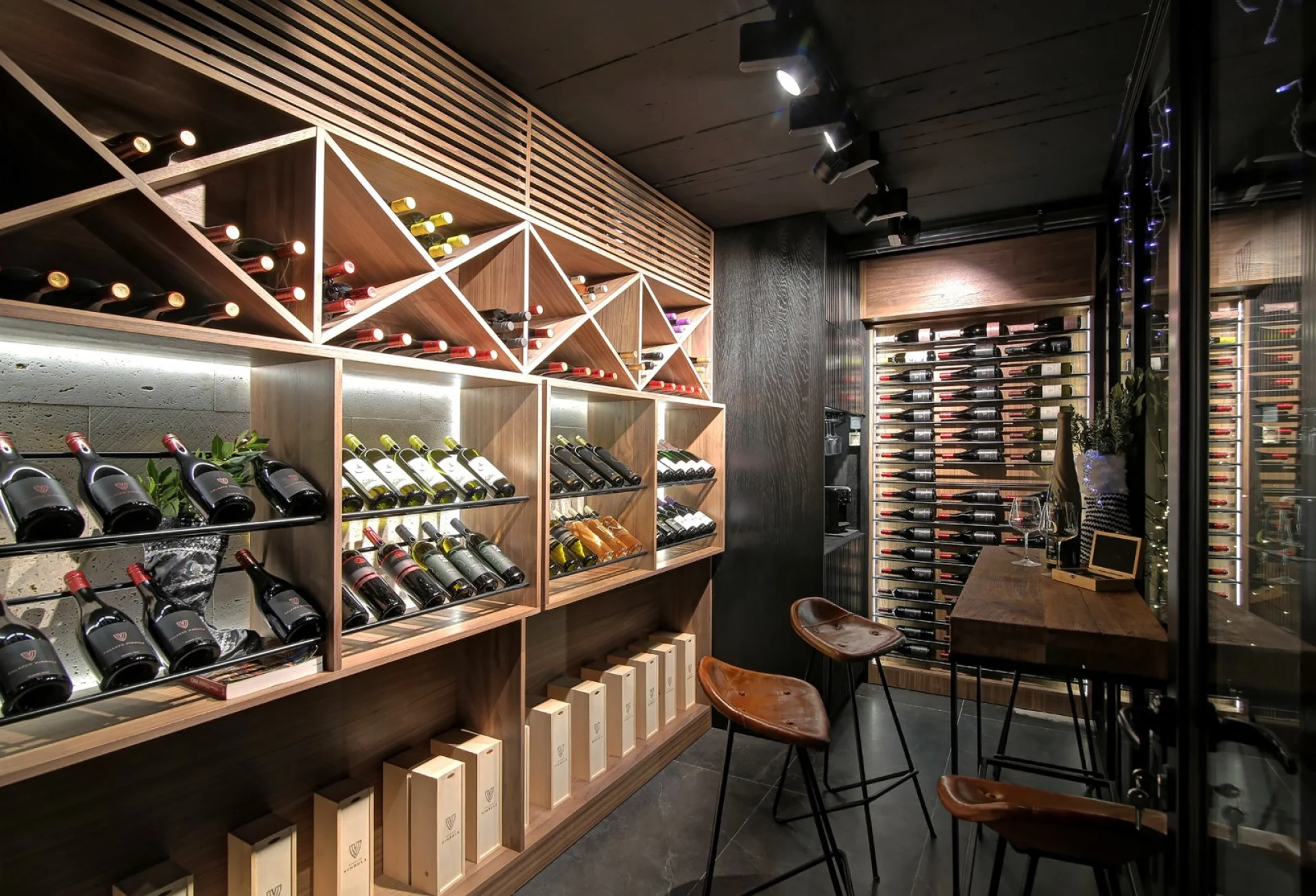 Wine cellar with racks and tasting bar at Villa Palazzo