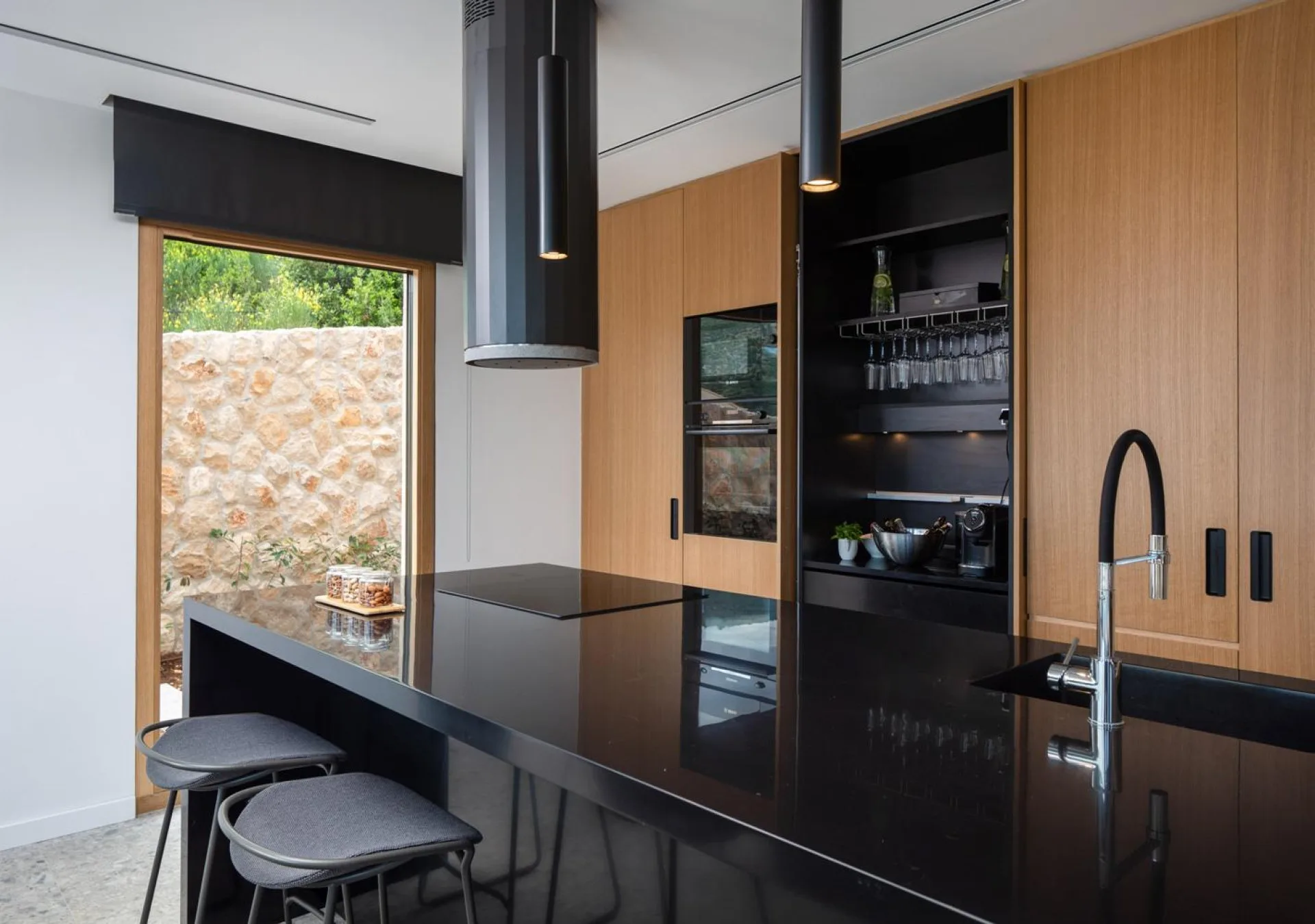 Black designer kitchen with island at Villa Palazzo