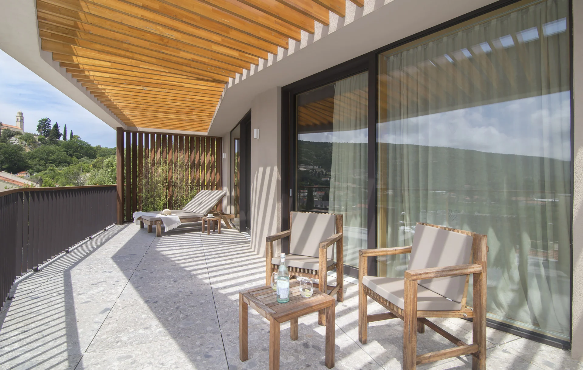 Balcony with chairs and countryside views at Villa Palazzo