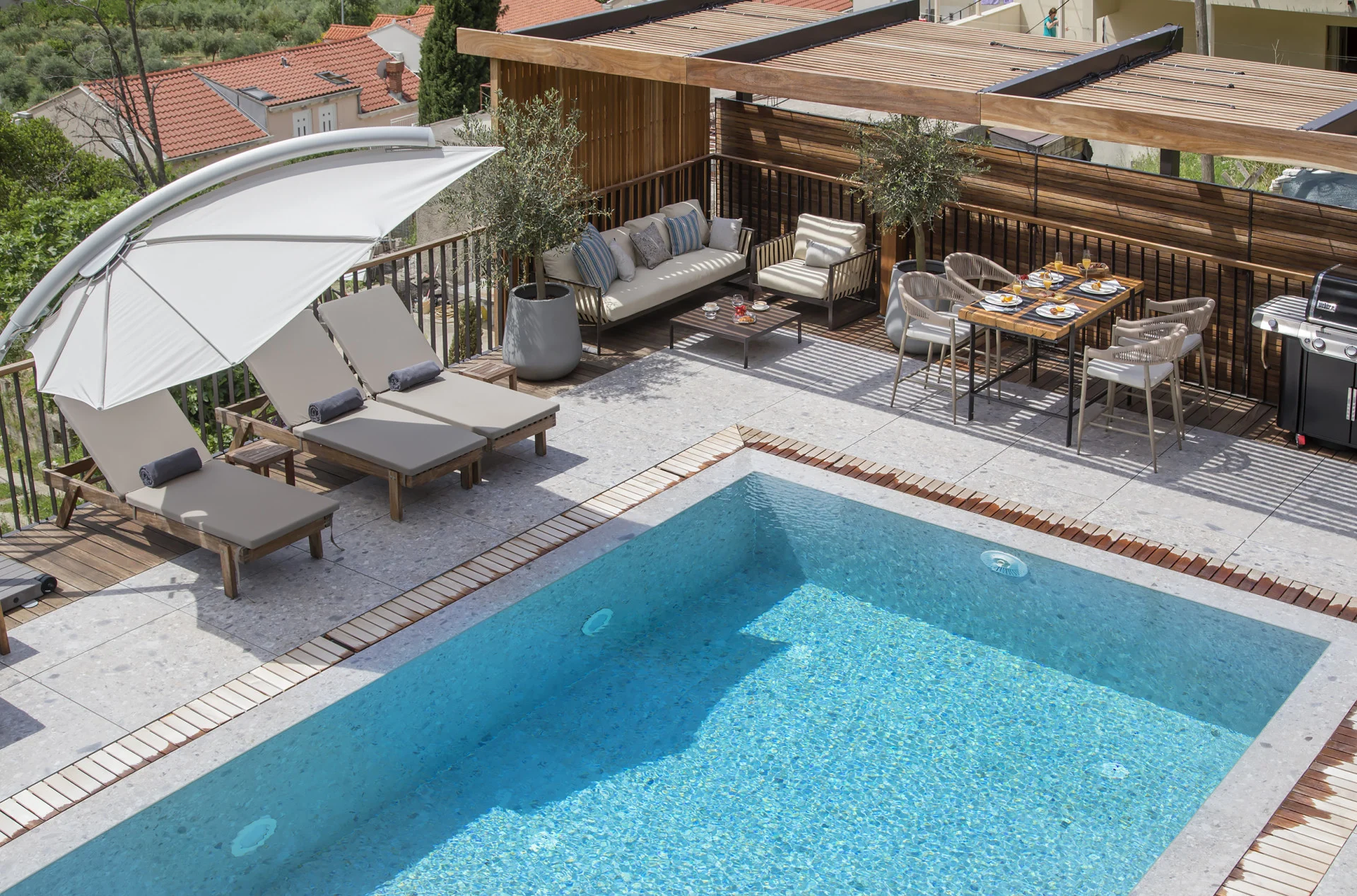 Overhead view of the pool and terrace lounge at Villa Palazzo