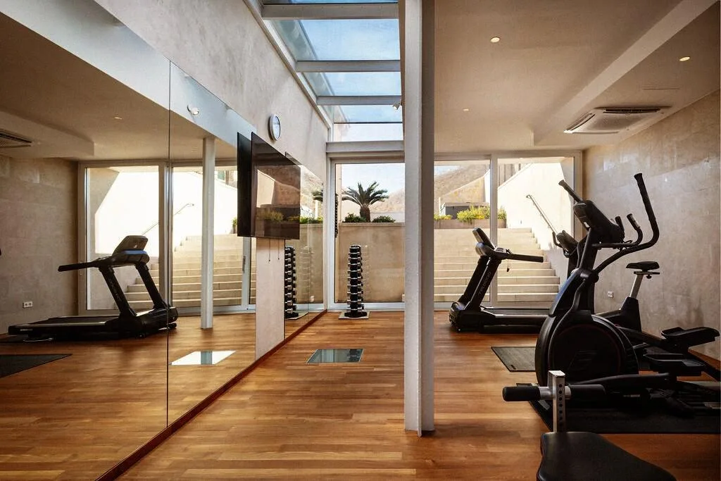 Private gym with treadmill and cross-trainer at Villa La Rose