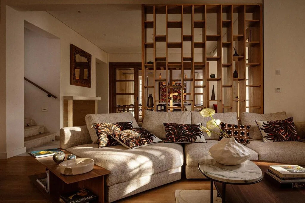 Lounge with patterned cushions and wooden lattice at Villa La Rose