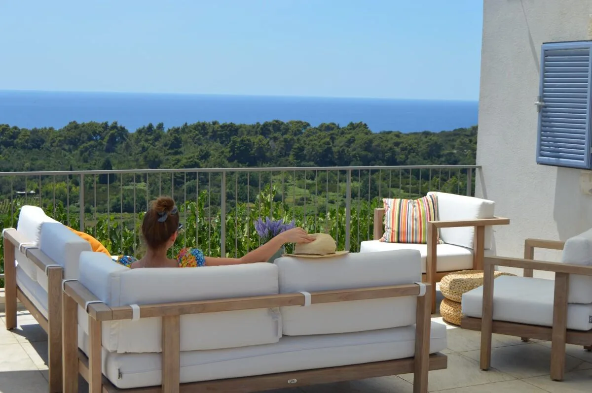 Terrace lounge with sofas and sea views at Villa Ella, Šipan