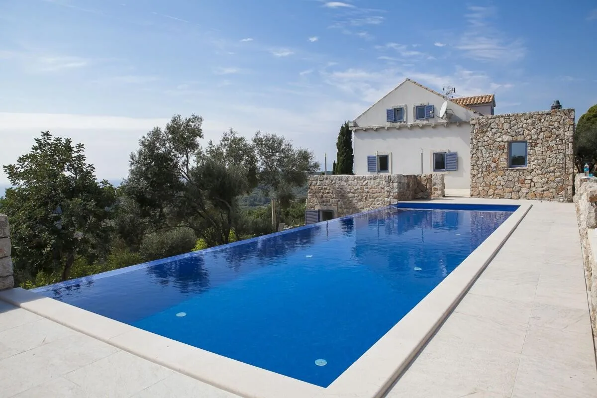 Long private swimming pool beside the stone Villa Ella on Šipan