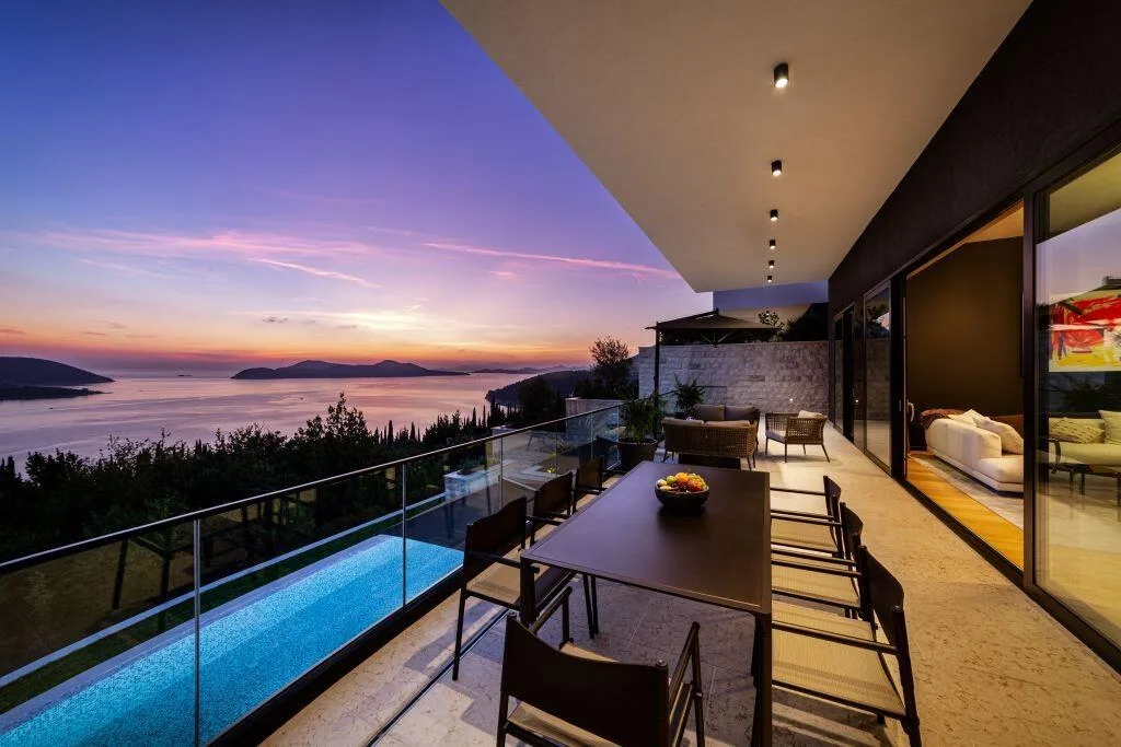 Terrace and infinity pool at dusk with Elafiti Islands view at Villa La Frida