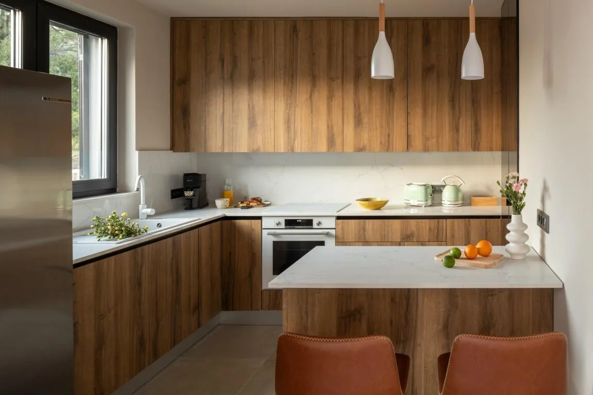 Fitted kitchen with breakfast island and bar stools at Villa Petra