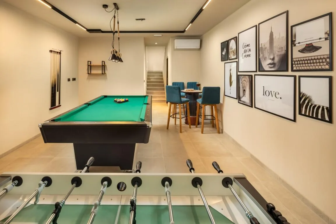 Games room with pool table and table football at Villa Petra