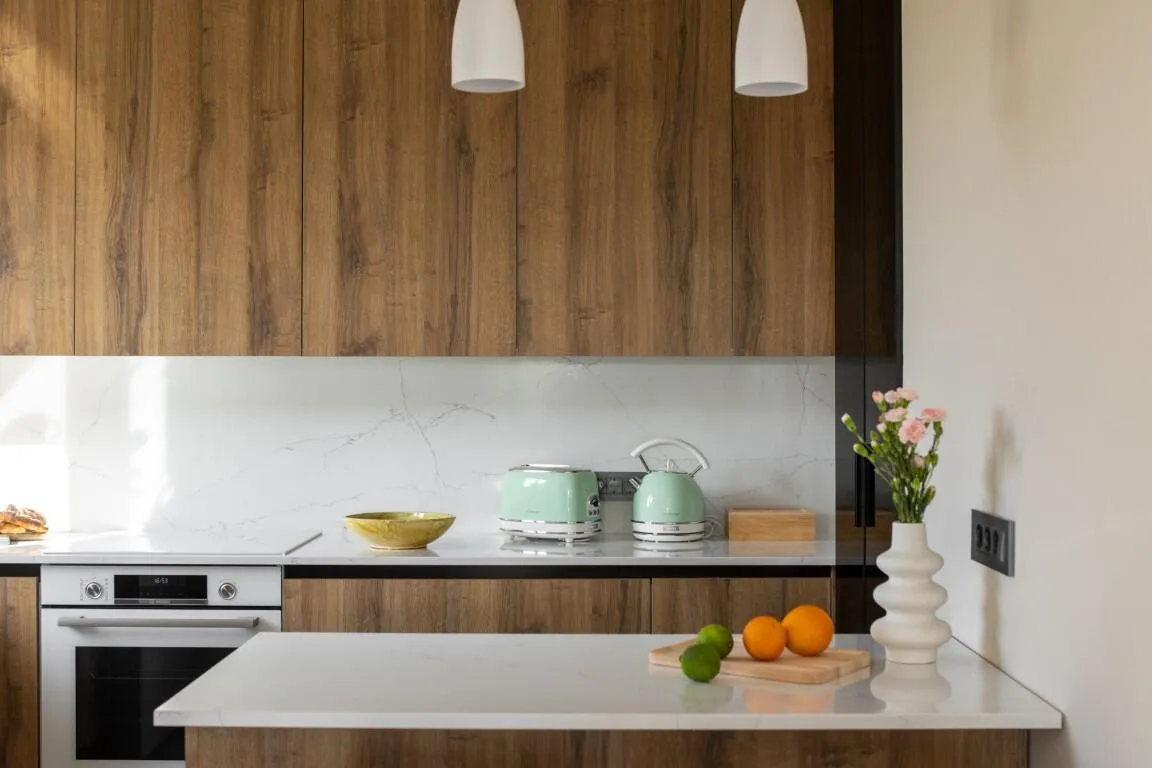 Modern kitchen with wooden cabinets and island at Villa Petra