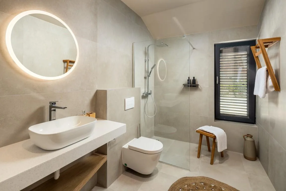 En-suite bathroom with vessel basin and walk-in shower at Villa Petra