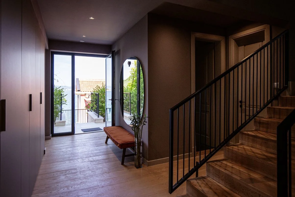 Entrance hall with staircase and terrace door at Villa Sol