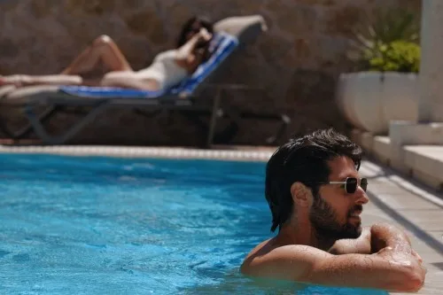 Guests relaxing in the private pool at Villa La Rose, Dubrovnik